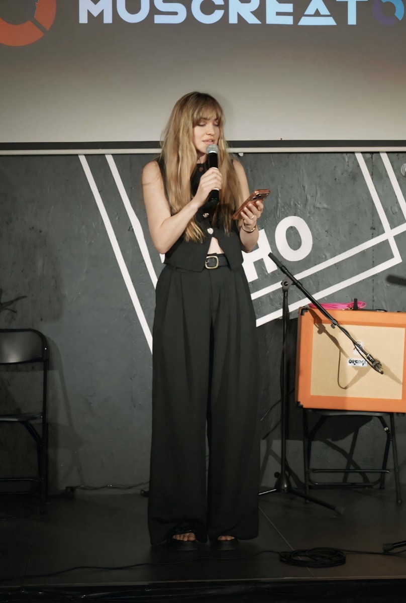 Olha Bilozir, founder of Muscreators, on stage at 21SOHO